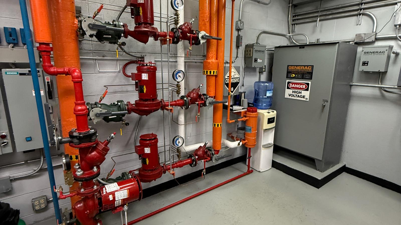 Pumps, valves and piping in a plant room